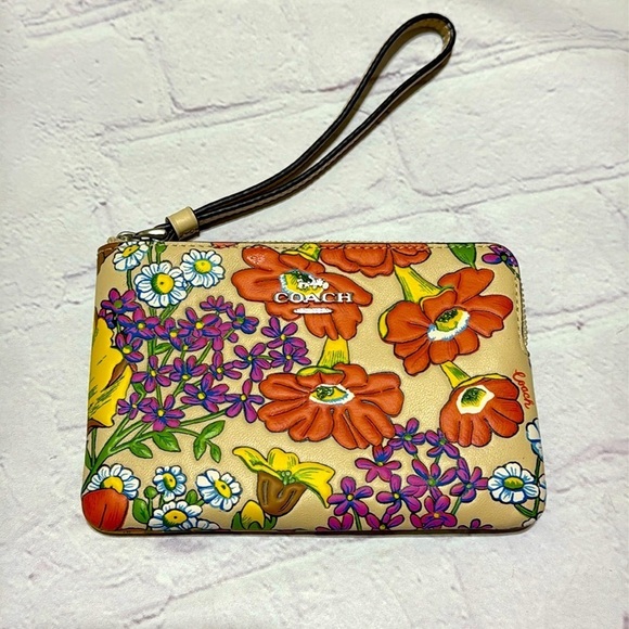 COACH Corner Zip Wristlet In Brown Signature Canvas With Wildflower Print nwt - Picture 1 of 14